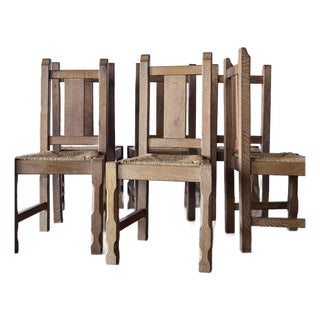 Set of Six 1960s Rustic French Oak Dining Chairs With Rush Seats For Sale