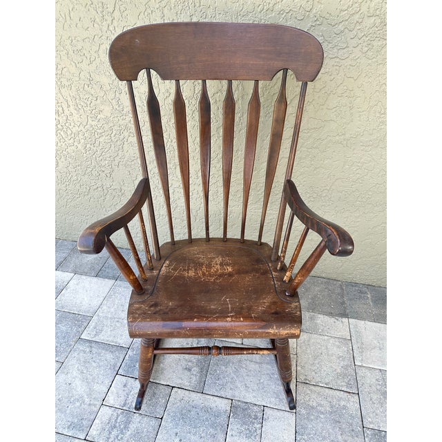Antique Colonial style rocking chair made by Bent & Bros. in Gardner, MA, USA. It is made out of maple wood and stained a...