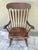Antique Colonial style rocking chair made by Bent & Bros. in Gardner, MA, USA. It is made out of maple wood and stained a...