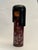 The Doll with a black wig and maroon red kimono with white blossoms and green leaves is a vintage Sosaku Kokeshi doll,...