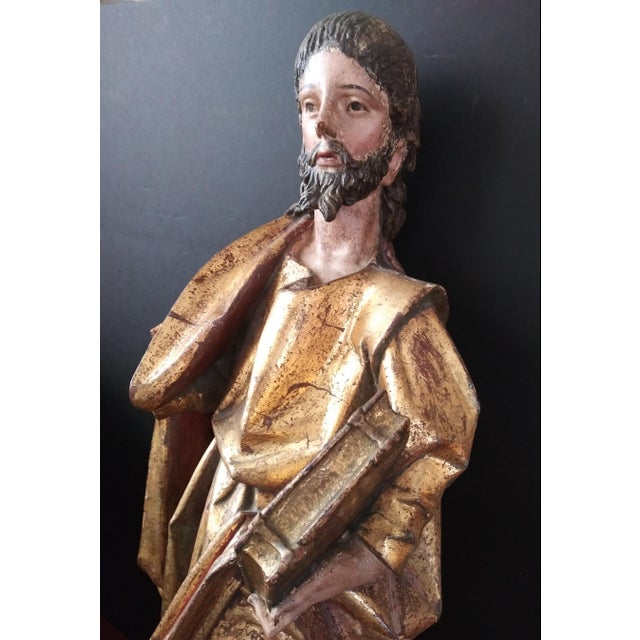 This large (39"H x 15"W x 12"D) 17th - 18th Century figure of Saint Paul, carved from a single block of hardwood, will...