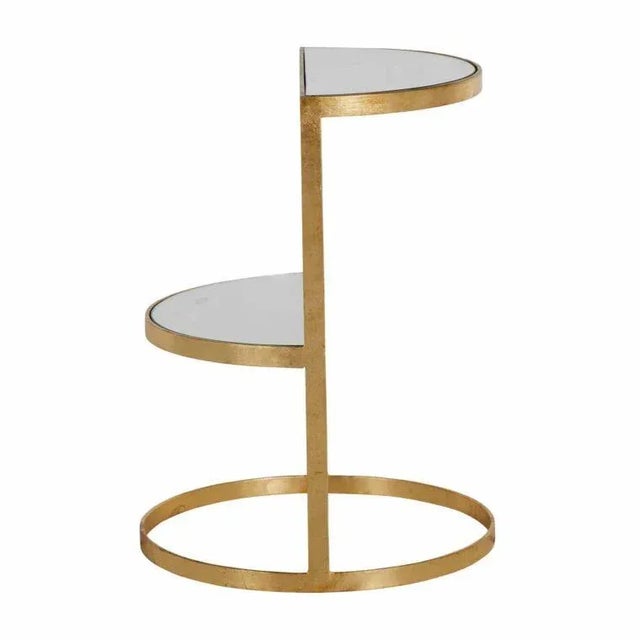 The Emmanuel Side Table This iron and mirror side table features a circular base and two opposing semicircular shelves....