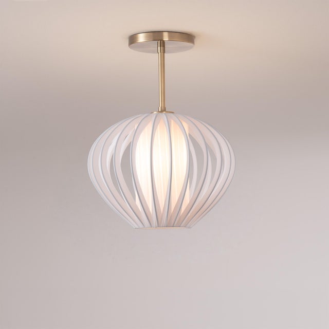 The Bloom Semi Flush Mount is a modern lighting fixture that combines a sleek white satin steel shade with a weathered...
