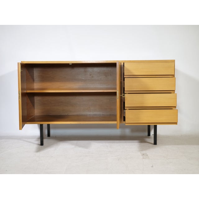 Mid-century walnut sideboard by Ernst Martin Dettinger for Bormann, 1960s, from the Cambor series. Rectangular body with...