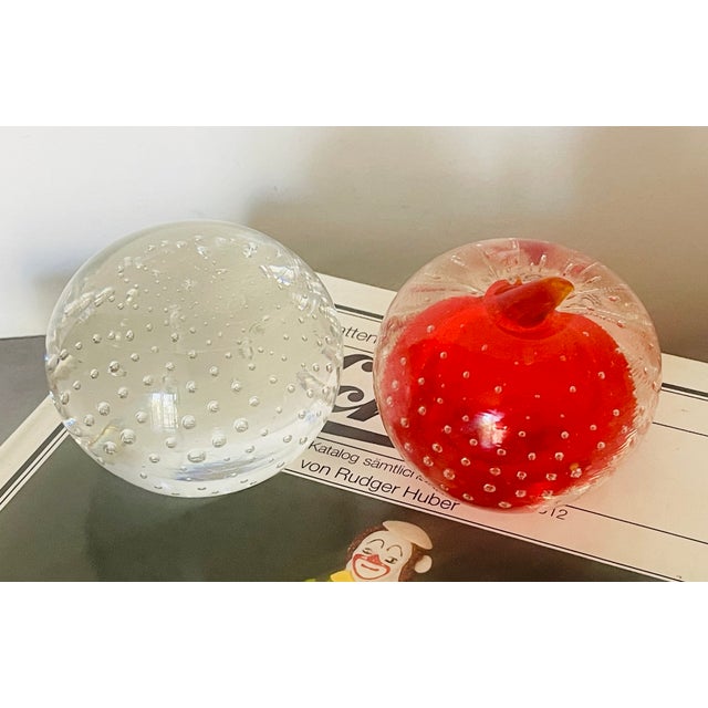 Beautiful contrast two controlled bubbles paperweights for modern decor or collectors.