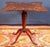 Elegant English Regency marquetry inlaid center table or occasional table with mahogany tripod base. The tabletop with...