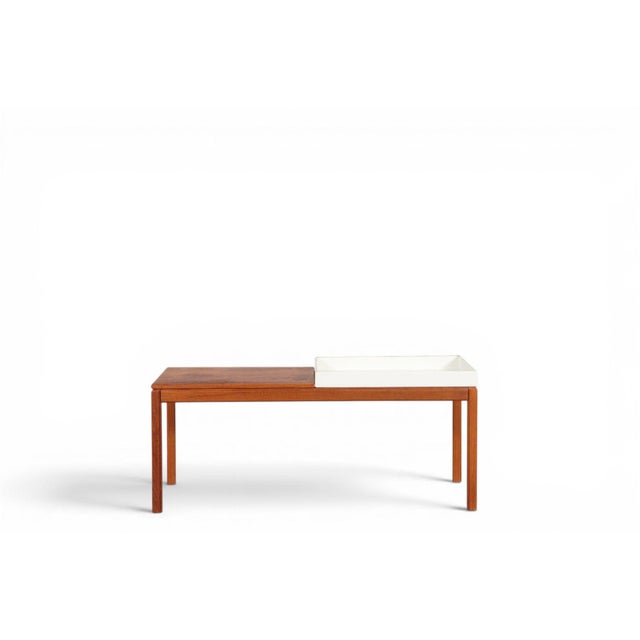This versatile Swedish modern bench doubles as a plant stand or low display shelf, crafted from warm teak with simple,...
