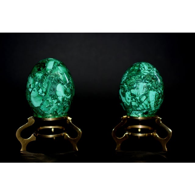 A luxurious and visually arresting pair of polished malachite eggs, each showcasing the stone’s unmistakable concentric...