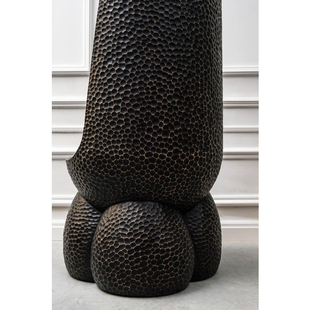 A massive wooden chair penetrated with the warmth and energy of handwork. The elegant shape and free lines together with...