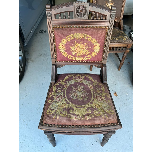 These antique chairs are in the Victorian Eastlake style, typically dating from the late 19th century. They feature...