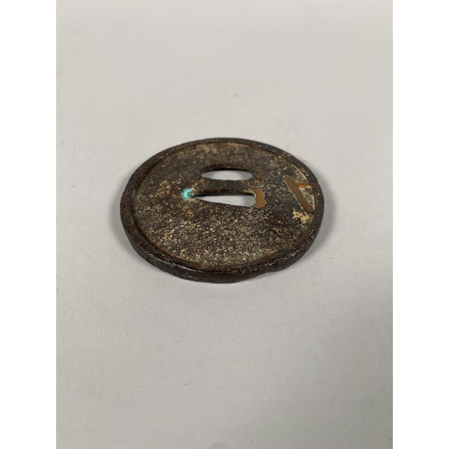 Maru-Gata tsuba, Edo period (1603-1868). Wrought iron inlaid with copper and gold, depicting a yōkai in the form of an...