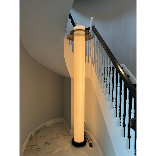 A dramatic custom illuminated column floor lamp by Donovan Lighting, Ltd. The sculptural design features a tall glowing...