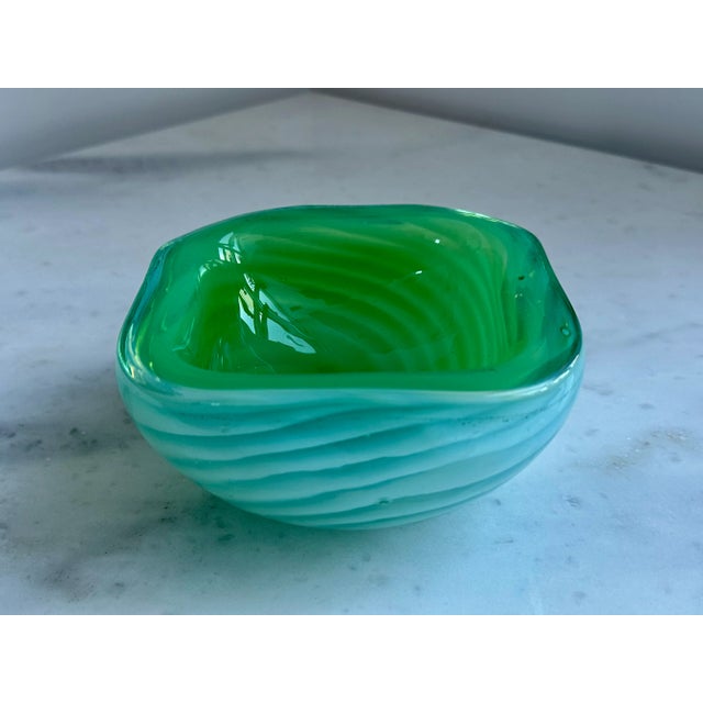 Beautiful vintage Murano hand-blown opal jade green Italian art glass bowl. The piece is attributed to the Cenedese. The...