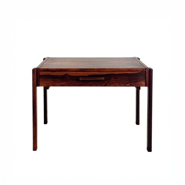 Perfect for bedside or sofaside, this vintage end table is sleek and beautifully crafted in Brazilian rosewood. Originally...