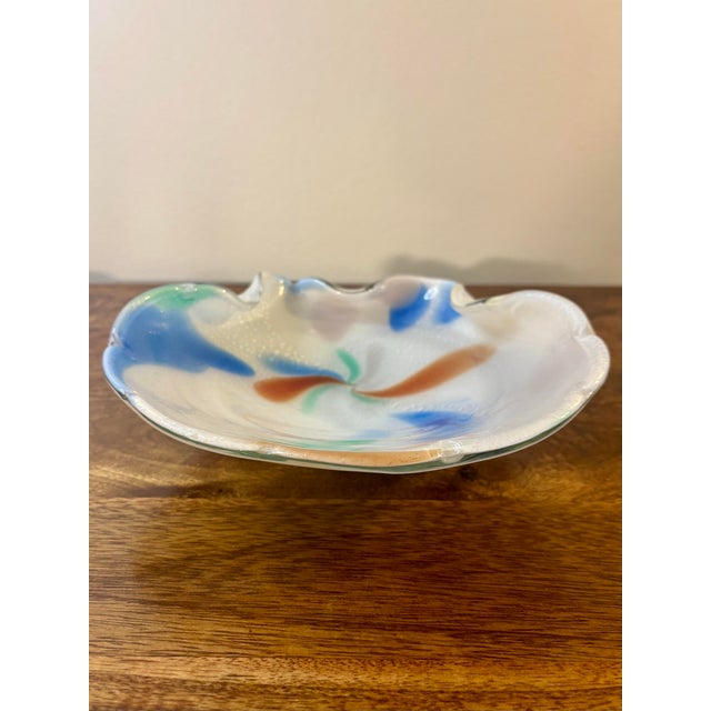 A beautiful vintage Murano art glass dish in an organic seashell form, featuring soft white glass fully encased in clear...