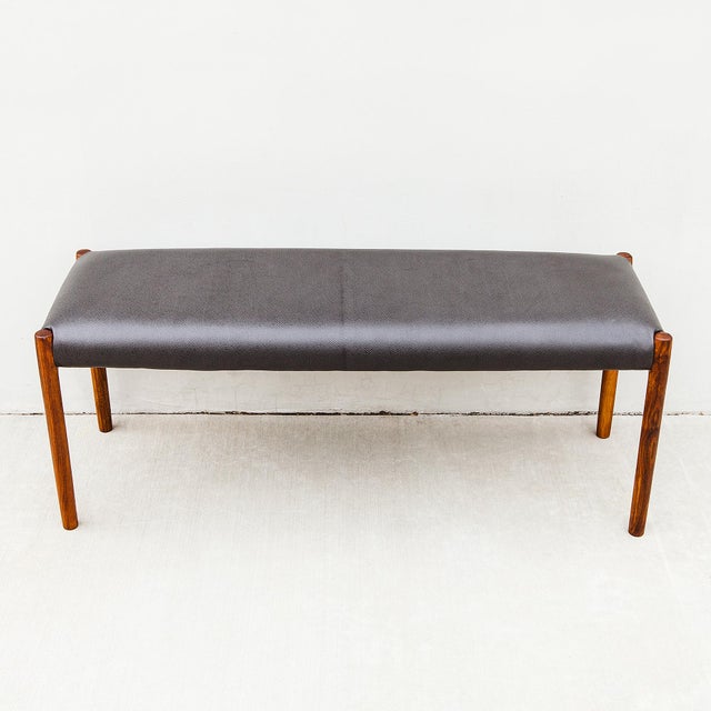 Fully restored Niels Moller Model 63A bench in walnut with slate leather upholstery, designed in 1963 and produced by J.L....