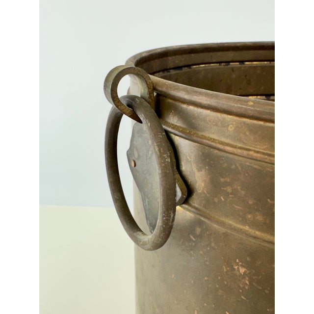 A unique vintage brass planter with wonderful timeworn patina and substantial architectural details. The cylindrical form...