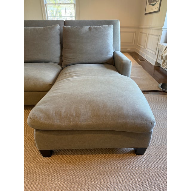 Comfortable three piece sectional upholstered in shark gray flat chenille fabric. Down cushions, wood feet, and a chaise...