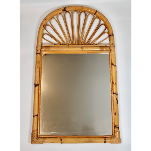 A superb vintage boho chic bamboo wall mirror with a lovely arch at the top and an intricate fanned design. This mirror...