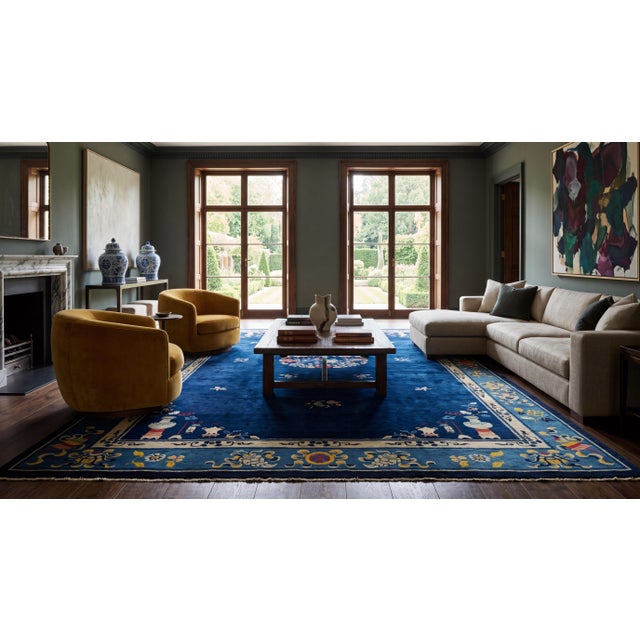 An exquisite example of early 20th-century craftsmanship, this antique Chinese Art Deco wool rug features a breathtaking,...