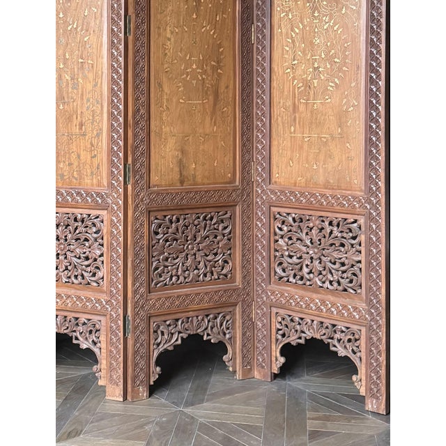 A Four-Panel Anglo-Indian Hardwood Screen, circa 1910.There is something inherently romantic about a folding screen - the...