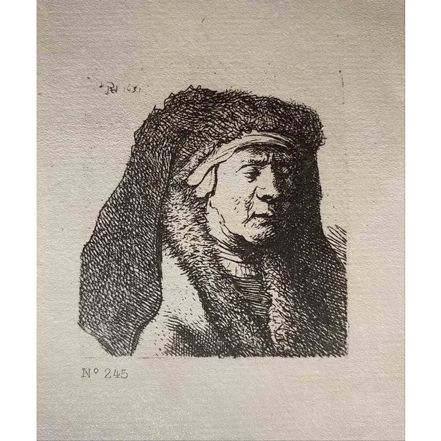 The Artist's Mother is an etching on ivory-colored paper realized after an etching by Rembrandt. This wonderful piece of...