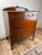 This handsome Depression Era chest of drawers, crafted from warm mahogany, captures the graceful transition of early 20th-...
