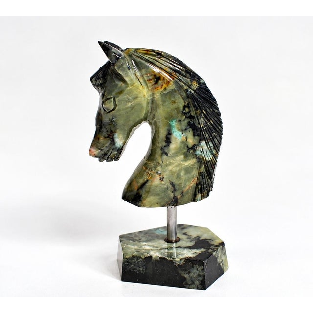 This hand-carved horse of natural emerald-bearing gemstone captures the grace and noble character of the horse in a modern...