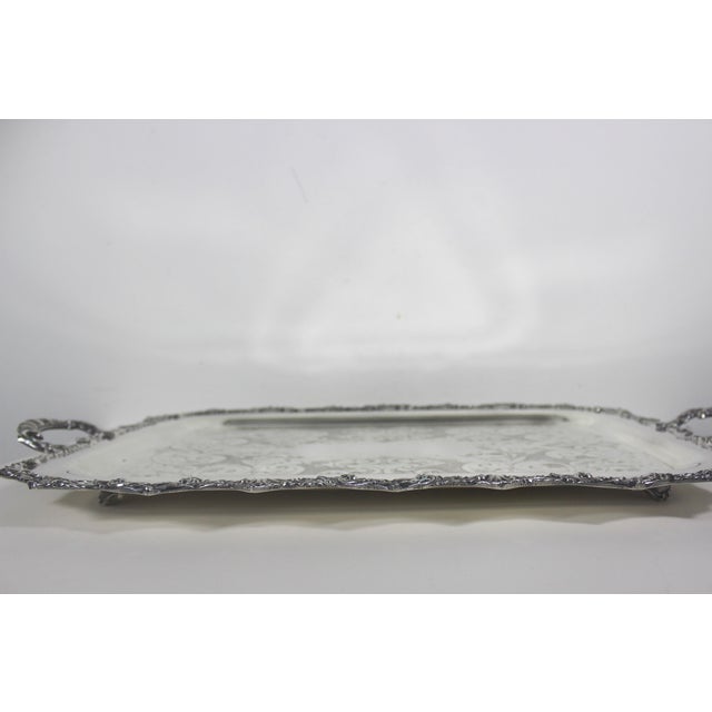 Extra large vintage rectangular silver plated tray with gorgeous ornate detail around the edge and ornate handles, and an...