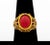 18K Yellow Gold Faux Coral Ring, decorated with one oval cabochon opaque red stone, marked: "750" with maker's mark....