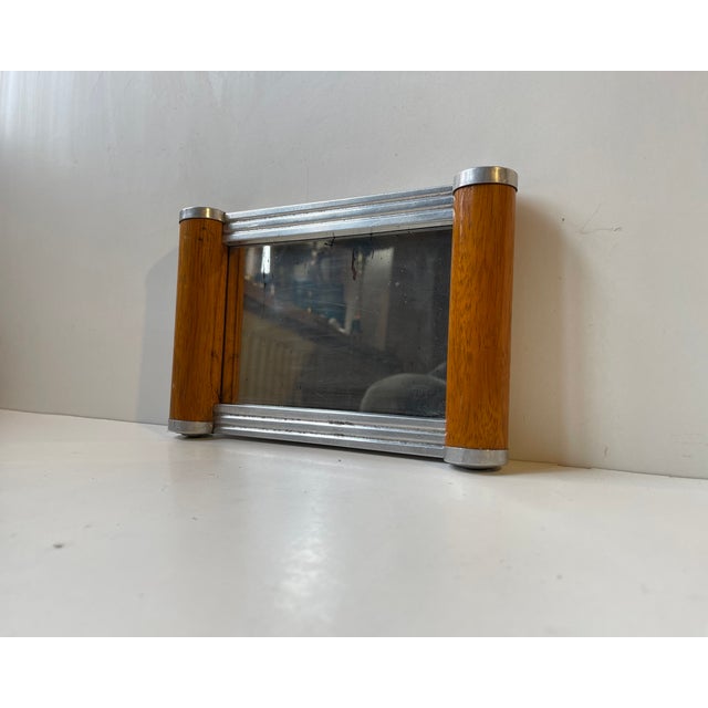 A small streamline mirror tray or plateau mirror. Originally used for vanity purposes, for jewelry or even for preparing...