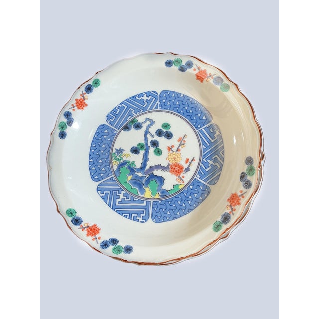 A stunning set of five vintage Japanese porcelain rimmed soup bowls, featuring an elegant Imari-inspired design in serene...