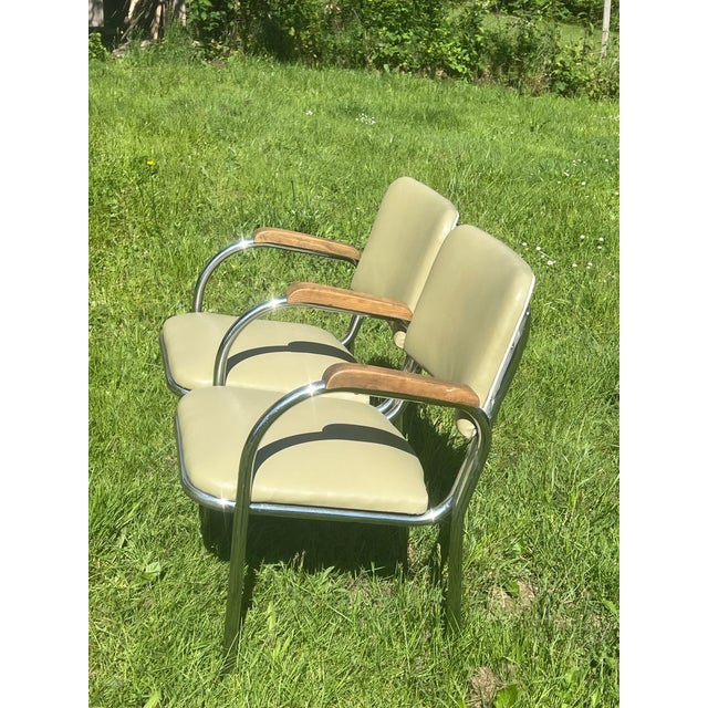 This unique chrome double arm chair bench was manufactured by Royal Metal Co. in Chicago, Illinois The modernist armchair...