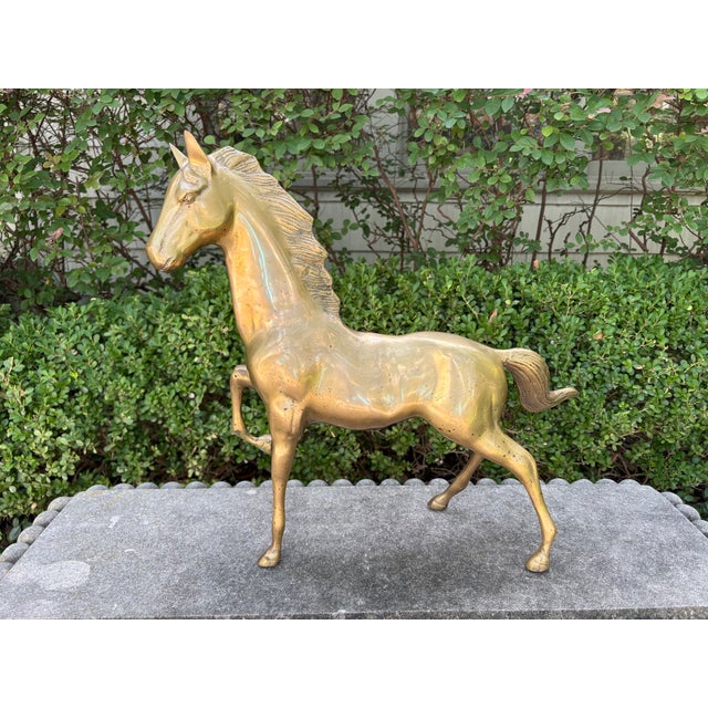 Large Hollywood Regency Brass Horse Sculpture. Offered is a beautifully detailed brass horse figure or horse sculpture...