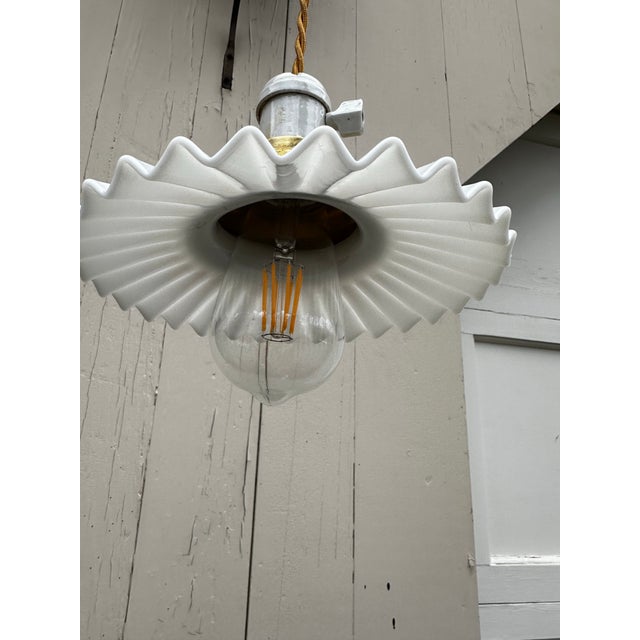 Old Lights On is pleased to offer this vintage knob and tube fixture with pinwheel shade. It is wired and ready to...