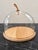 The Ivalo dome by LSA International, the London glassware studio: a mouth-blown glass cloche on a solid ash base with a...