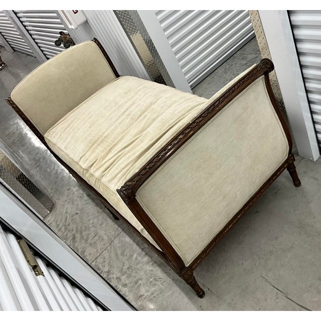 Stunning antique French Daybed functions beautifully also as a sofa or settee. Wood frame with carved gold accents and...