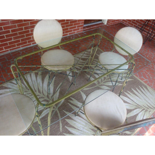 Versatile vintage wrought iron patio dining table with four chairs, attributed to Maurizio Tempestini for Salterini due to...