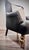 A beautifully refinished accent armchair features a sculpted wood frame painted in rich satin black with hand-applied...