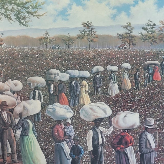 Hulis Mavruk "Bales of Dignity" framed art print depicts a powerful scene of figures carrying cotton bales through a field...
