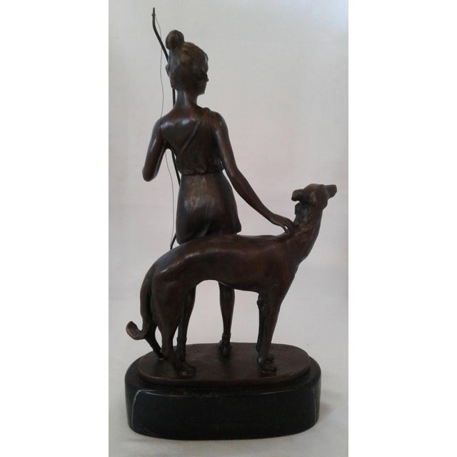 Elevate your collection with this magnificent Art Deco bronze sculpture, "Diana the Huntress with Borzoi," signed by the...