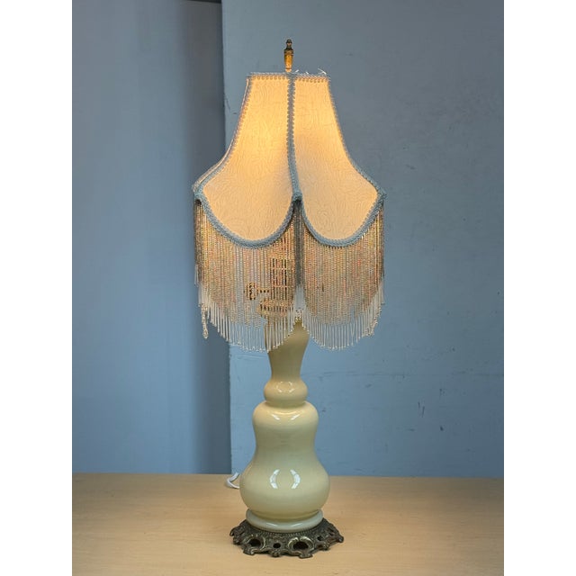 Design Plus Gallery presents a Porcelain Table Lamp with Victorian Style. The body is a buttery yellow tone, light and...