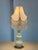 Design Plus Gallery presents a Porcelain Table Lamp with Victorian Style. The body is a buttery yellow tone, light and...