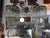 A pair of early 20th century articulated crystal wall sconces, three tears of crystal drops held on a brass surround. The...