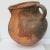 Stoneware grain jar from Columbia. Stoneware body fired in open pit kiln with singe marks to the sides. Handmade and hand-...