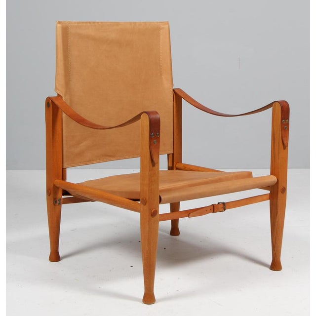 Kaare Klint for Rud Rasmussen. Safari chair new upholstered with Vintage aniline leather. Straps maintained in the...