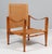 Kaare Klint for Rud Rasmussen. Safari chair new upholstered with Vintage aniline leather. Straps maintained in the...