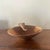 Made in Kenya. A charming mid-century hand-carved wooden catchall bowl featuring a sculptural elephant figure. Crafted...