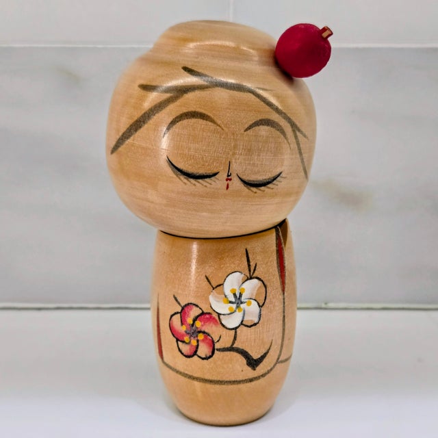 Bring a touch of serene Japanese charm to your shelf or tabletop with this minimalist hand-turned wooden kokeshi doll,...