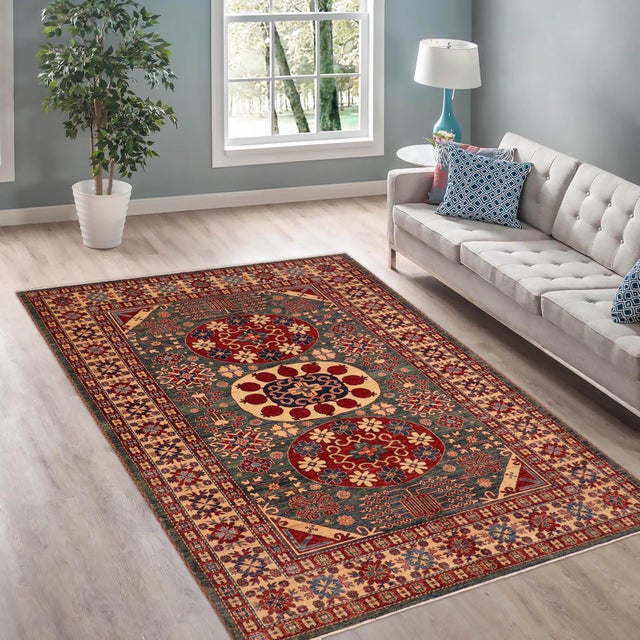 Enhance your home with this exquisite hand-knotted Super Kazak rug, crafted from fine hand-spun wool and dyed with all-...